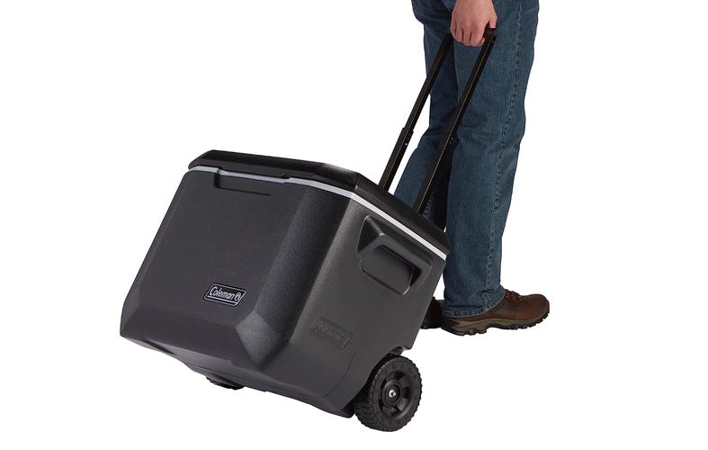 Person pulling coleman cooler
