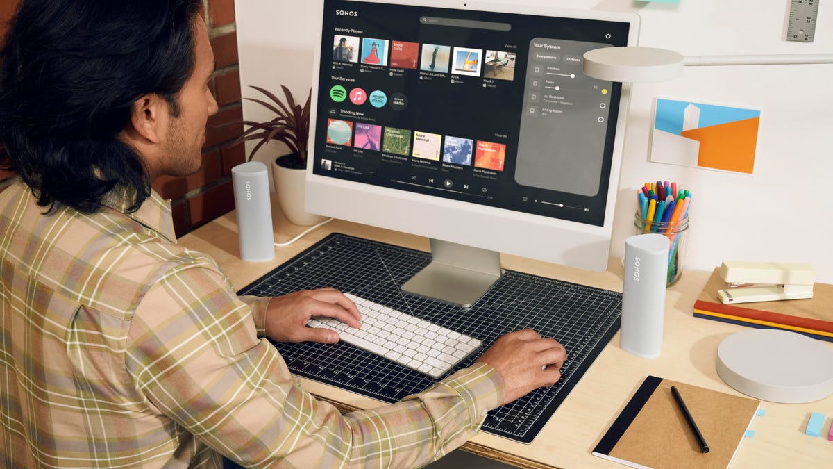 person using Sonos' new web app on a desktop computer