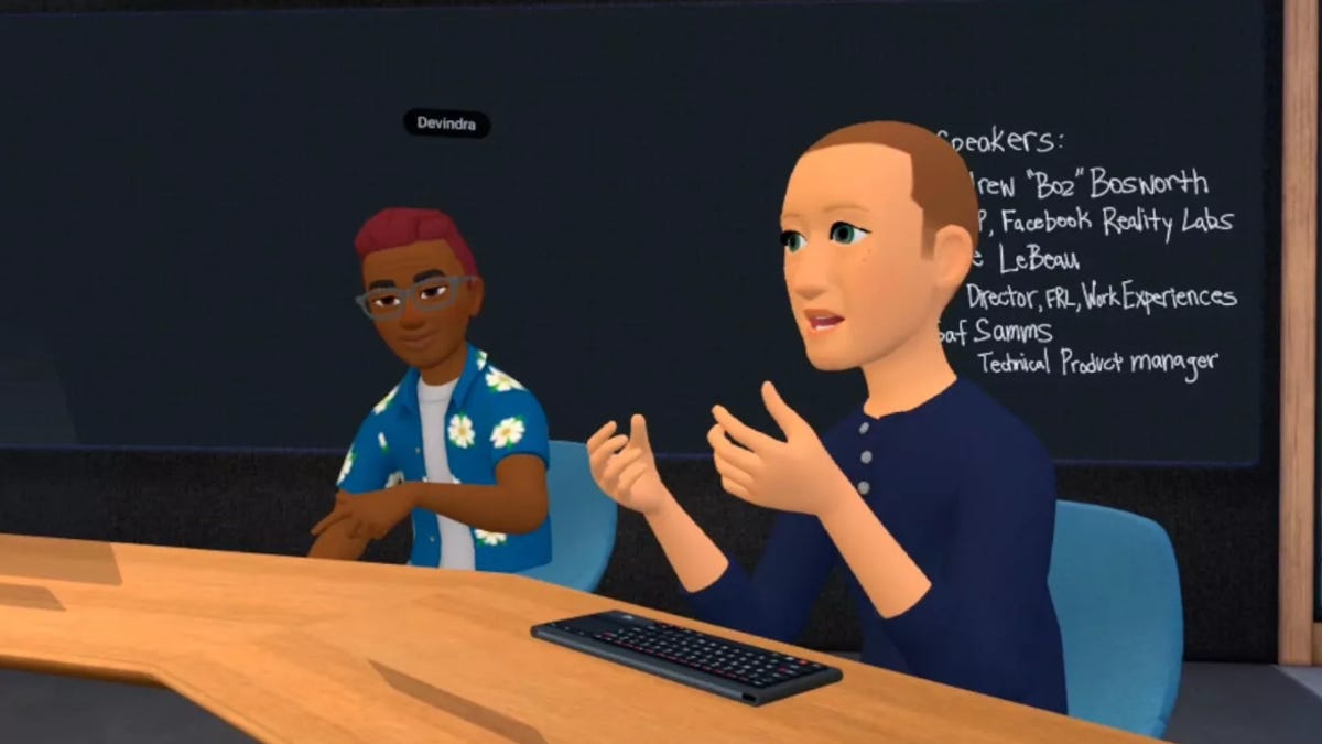 An avatar of Mark Zuckerberg sitting at a desk in a virtual reality workspace.