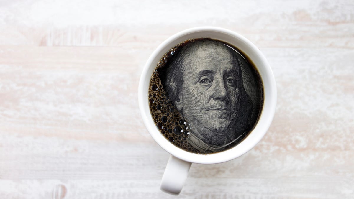Ban Franklin's face in cup of coffee