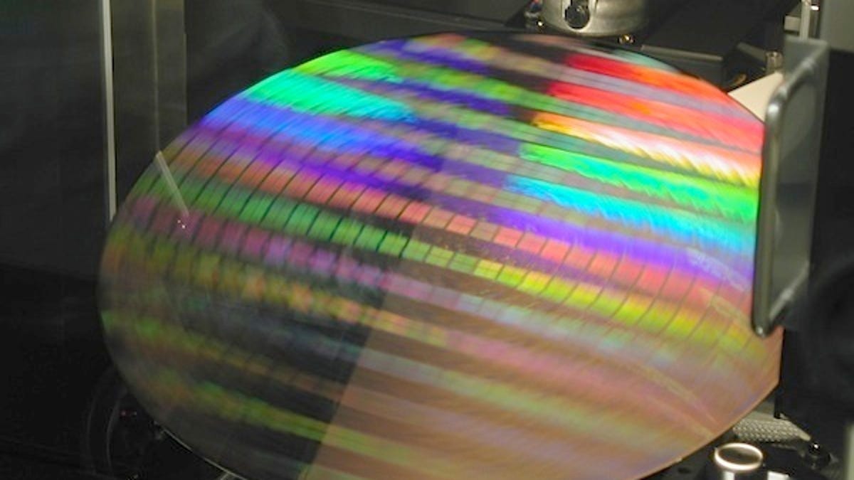 Intel wafer. Chipmakers may find it difficult to justify the huge costs of developing the next generation of chip technology.