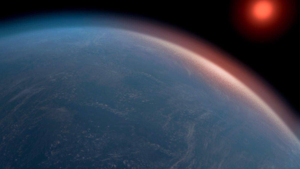 Dark blue planet on black sky with sun