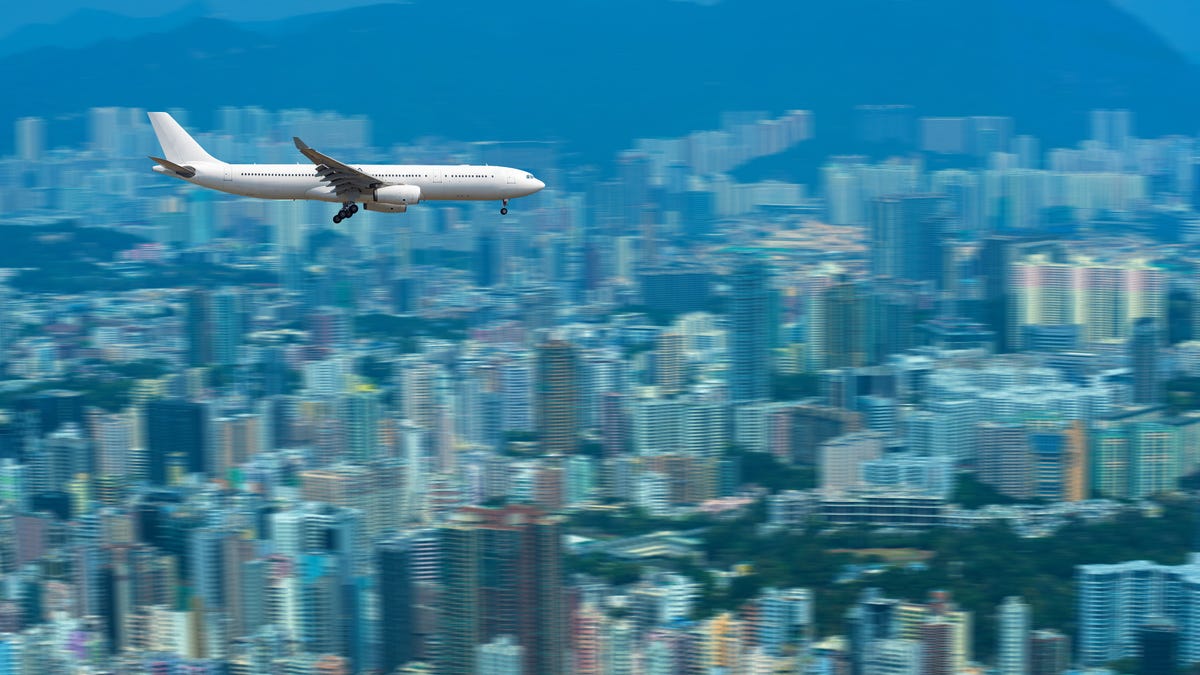 An airplane over a city scape