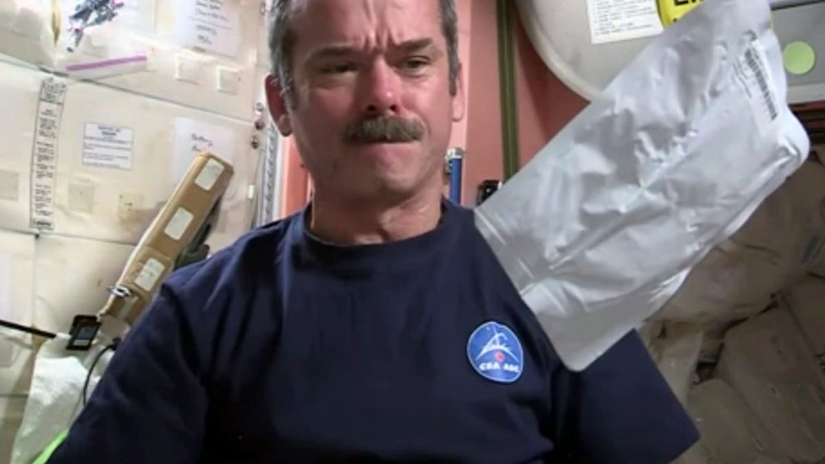 Chris Hadfield shows how to make a peanut butter and honey sandwich on the International Space Station