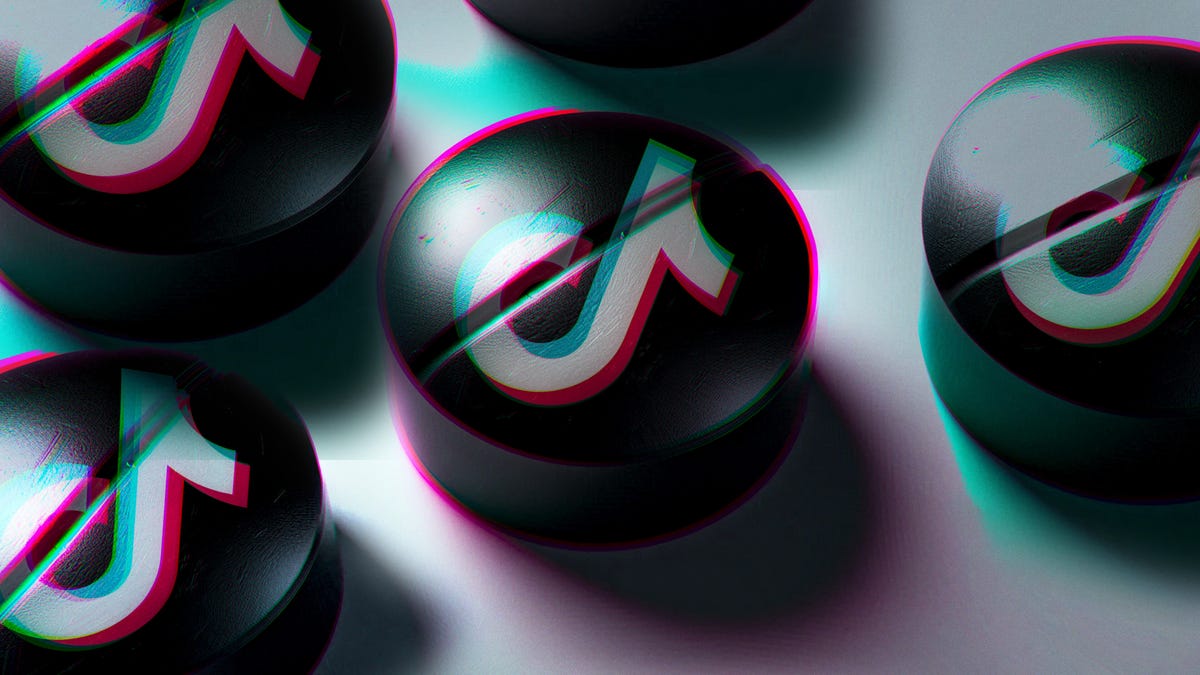 Tablet pills with the TikTok logo spread across a white surface