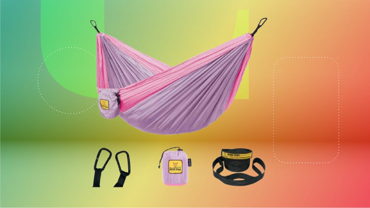 A pink and purple hammock with d-rings, a bag and a rope handle. Background: green, yellow and red orange.
