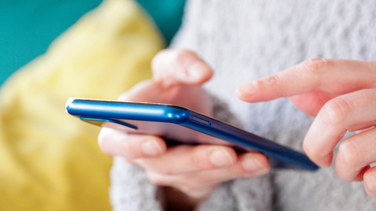 person-using-iphone-gettyimages-2063243000