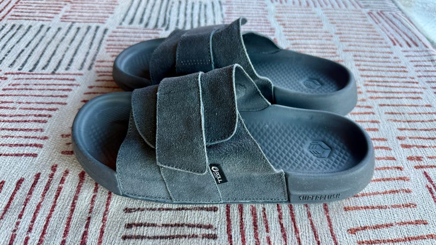 Roll Recovery SuperPlus Solace slides in blue on carpet viewed from the side at a low angle