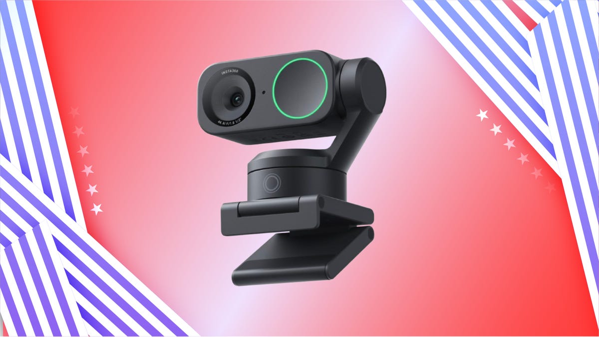 Black webcam against orange and magenta gradient.