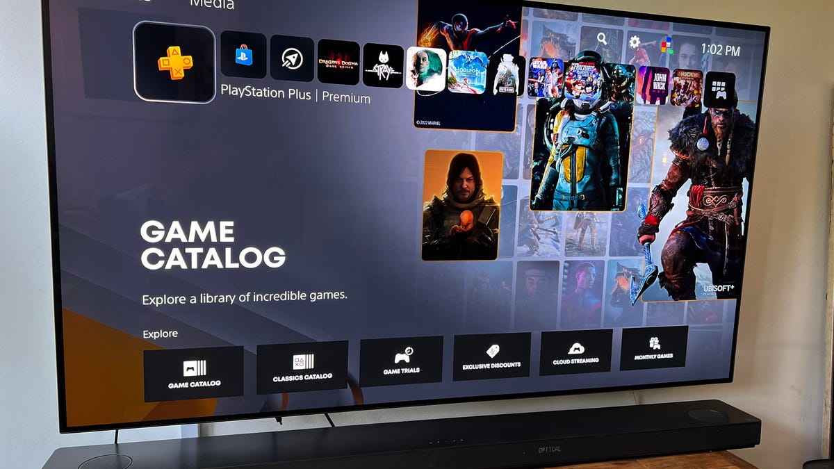 A TV screen showing the PlayStation Plus menu.