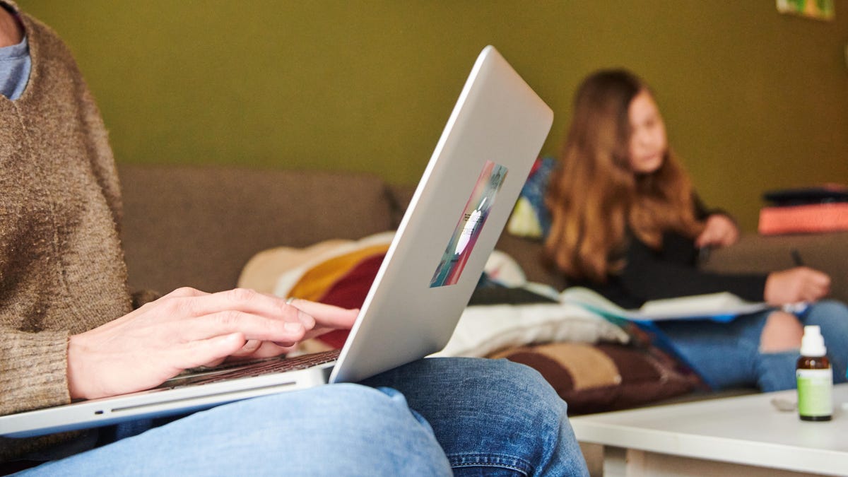 Typing on a MacBook computer