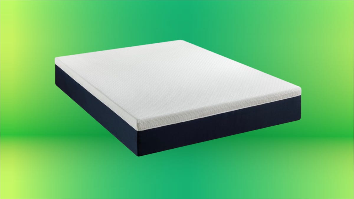 White mattress with black bottom edge. Background: lime and grass green gradient.