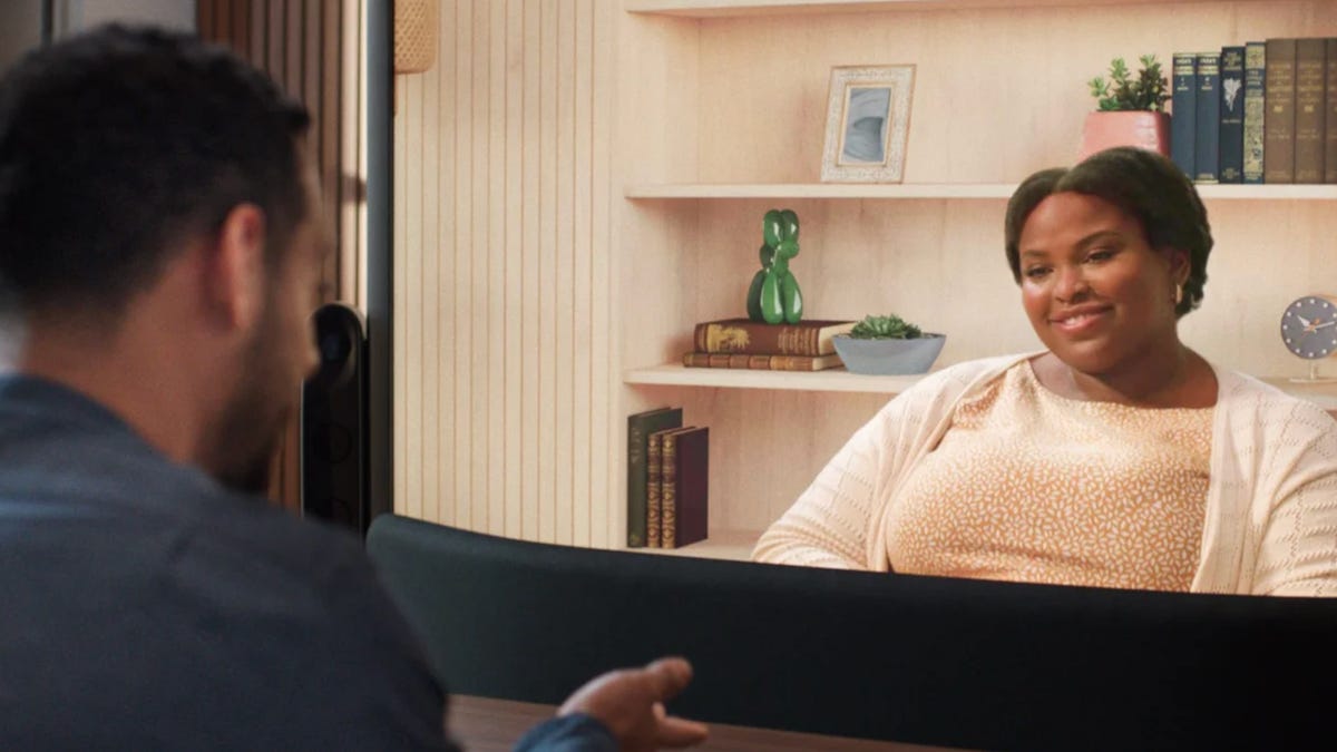 Two people chat using Project Starline