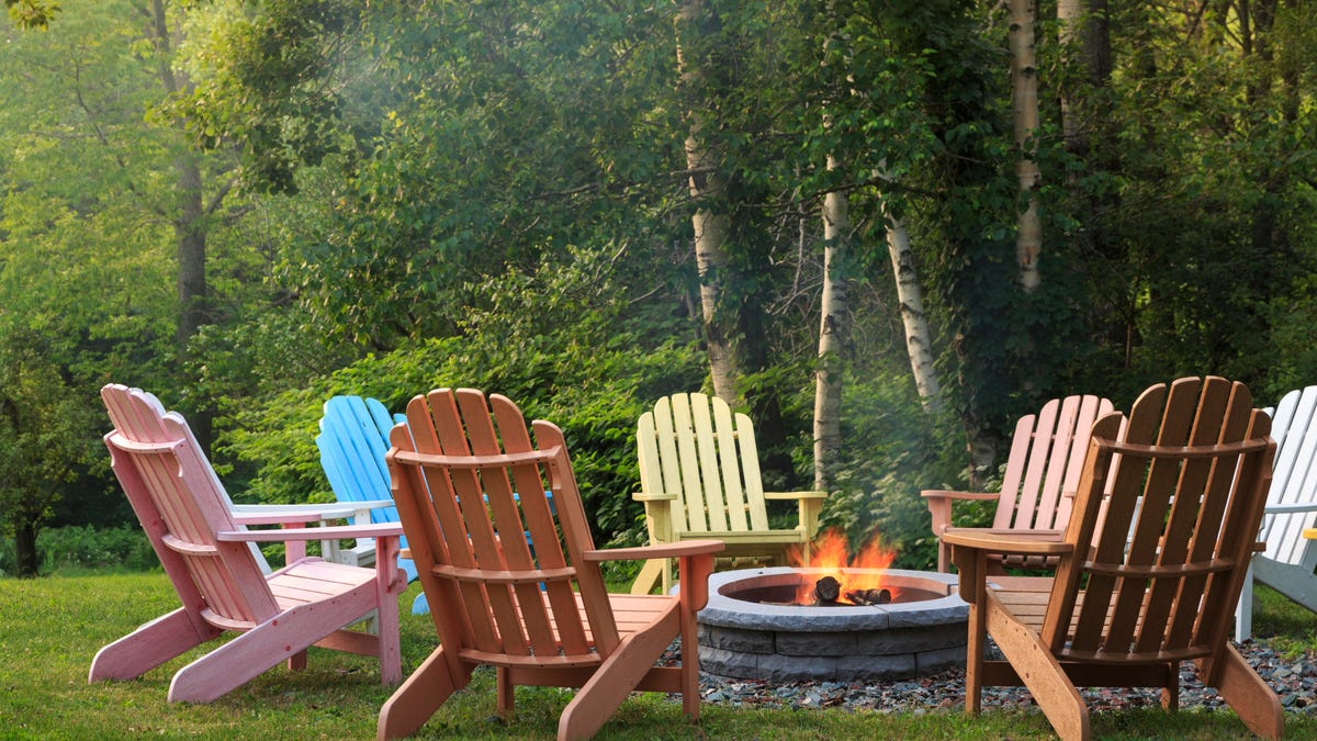 Colorful chairs around a fire pit