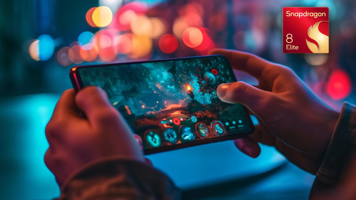 A person holds a phone sideways to play games.