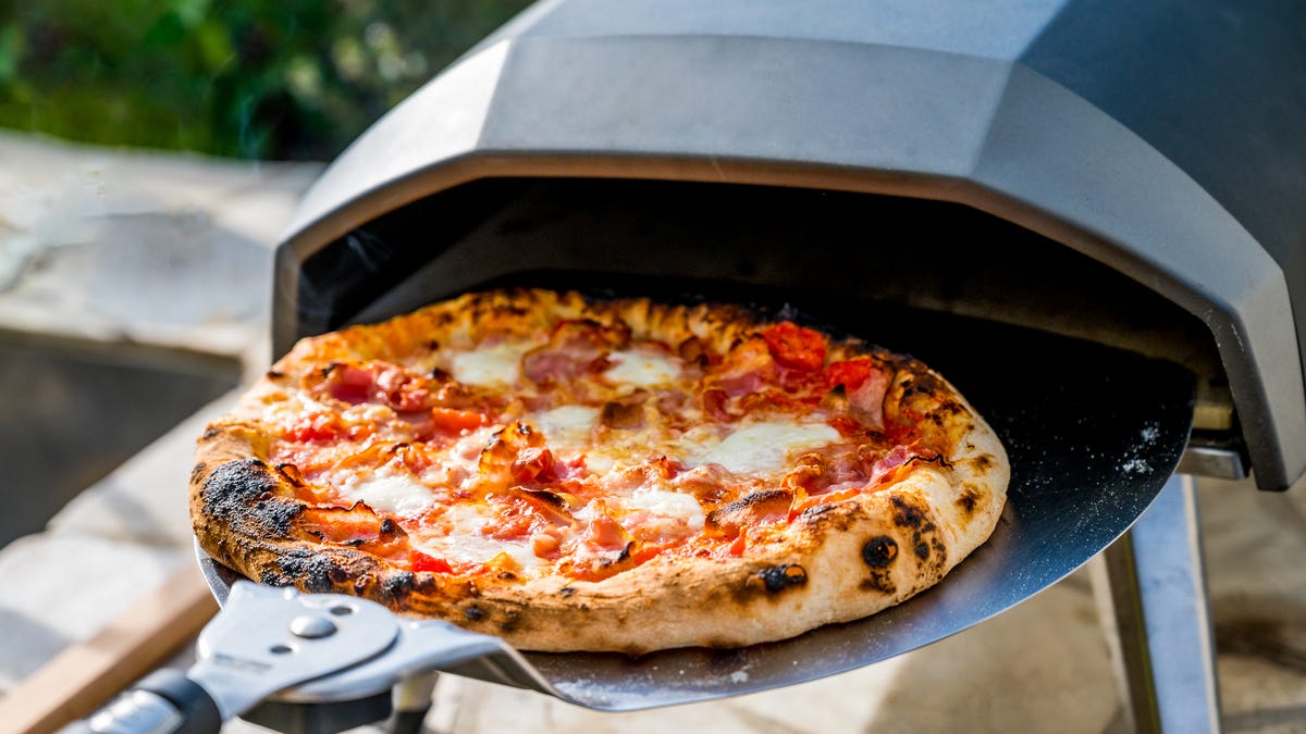 pizza being pulled from home pizza oven