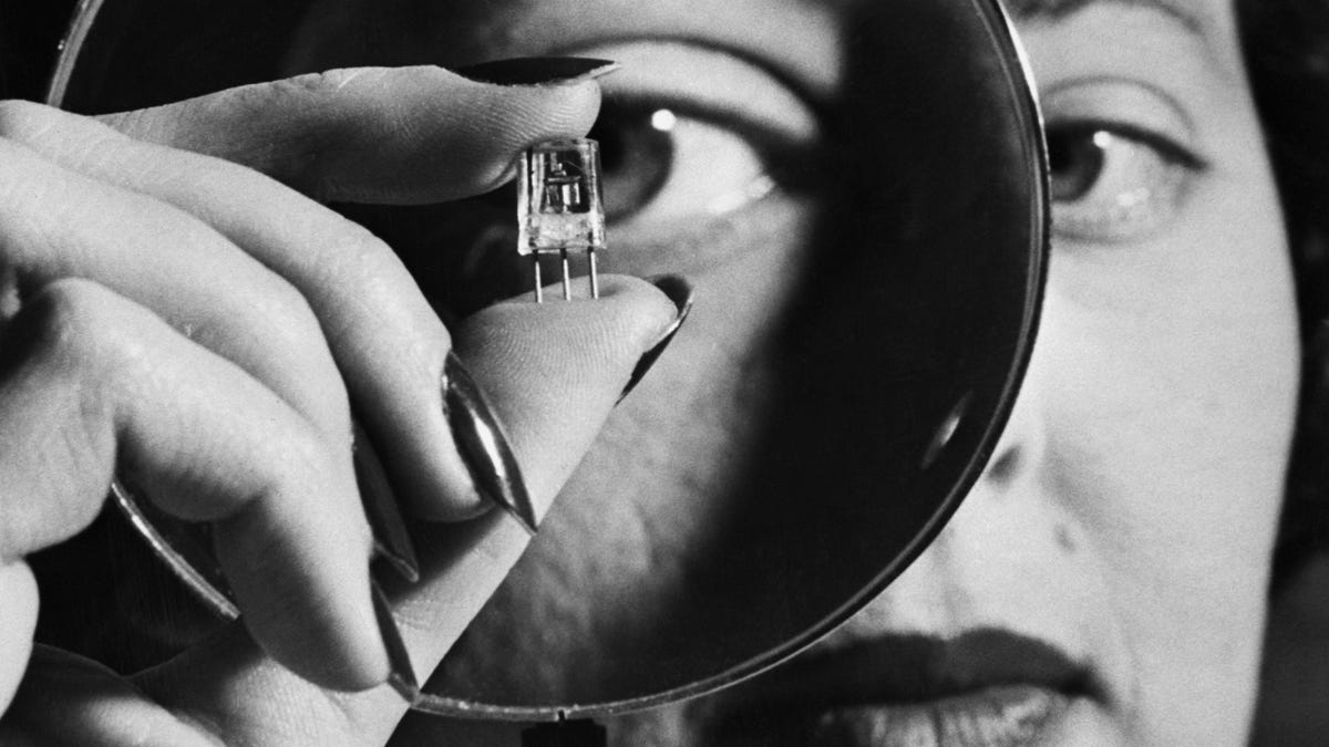 Inspecting a transistor? Or her paycheck? Critics of Silicon Valley's bro culture would no doubt say it's the latter.