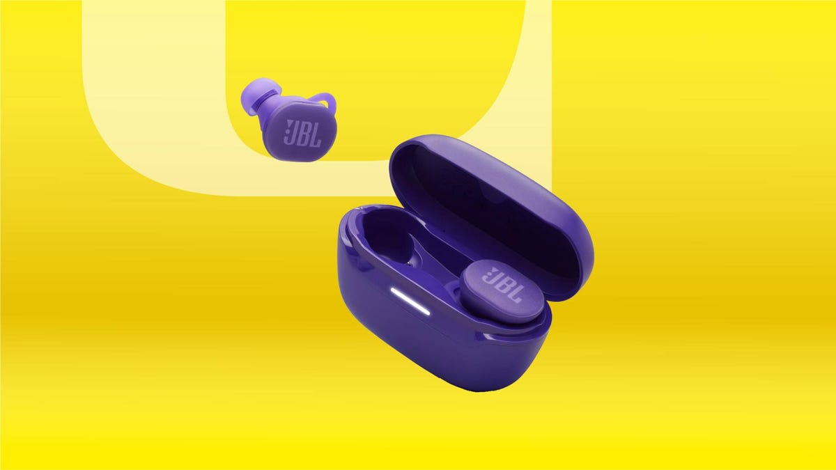 A pair of purple earbuds against a yellow gradient CNET background.