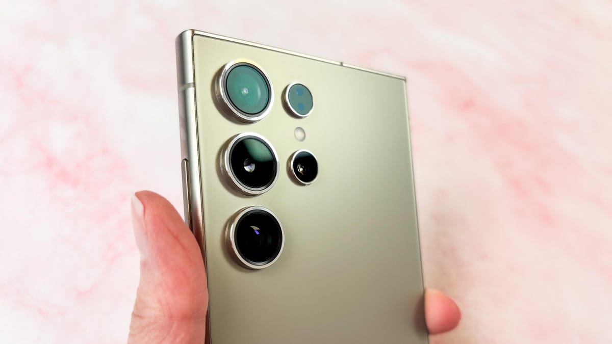 The Samsung Galaxy S24 Ultra's cameras against a pink marble surface