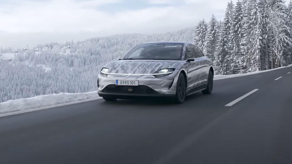 Sony Vision-S on a road in front of a snowy forested landscape