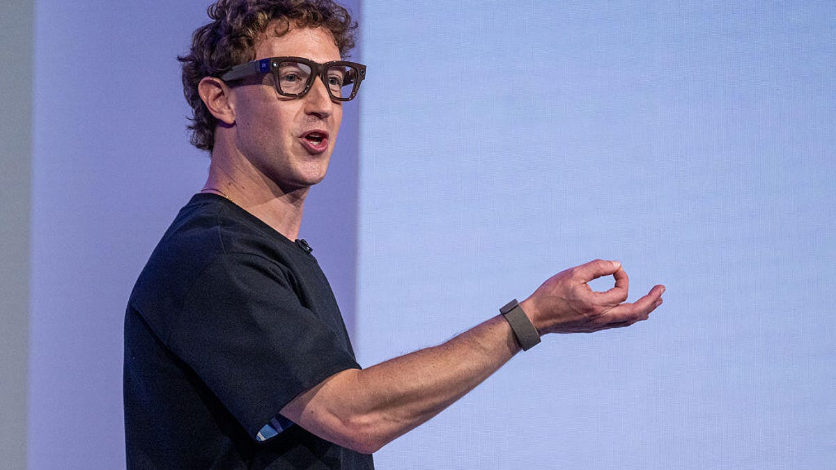 Mark Zuckerberg in a black T-shirt and wearing Meta Ray-Ban Display glasses