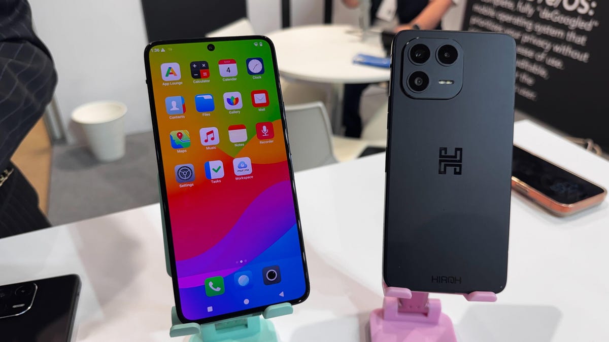 A pair of phones, one with the screen facing forward and the other with the back facing forward.