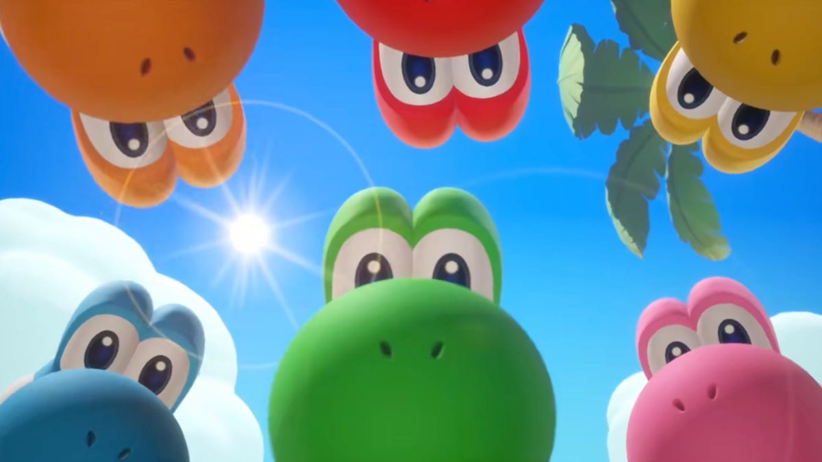 different color yoshis look down at the camera