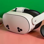 The Meta Quest 3S VR headset and controllers with a pink and green background