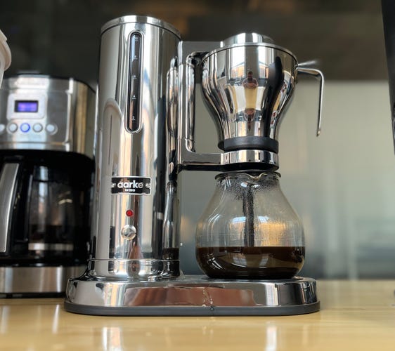 silver coffee machine with a glass caraffe 