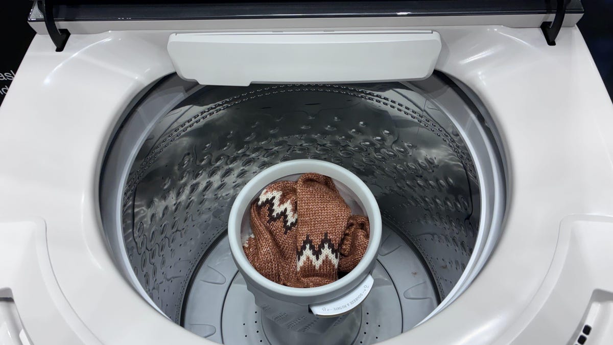 A sweater in delicates basket in washing machine