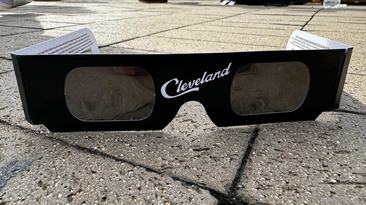 Image of solar eclipse glasses that say Cleveland, on the plaza at the Rock and Roll Hall of Fame.