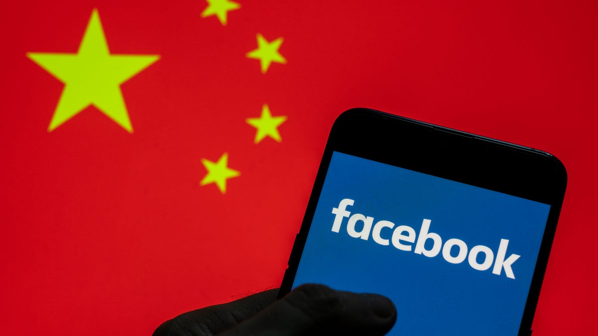 Facebook logo seen on an Android mobile device with People's Republic of China flag in the background.