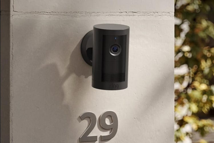 Ring's Outdoor Cam mounted on a stucco wall. 