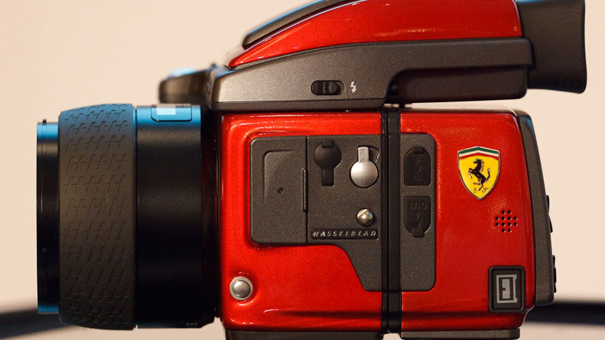Hasselblad's unveiled a limited-edition Ferrari-branded H4D medium-format camera at Photokina.