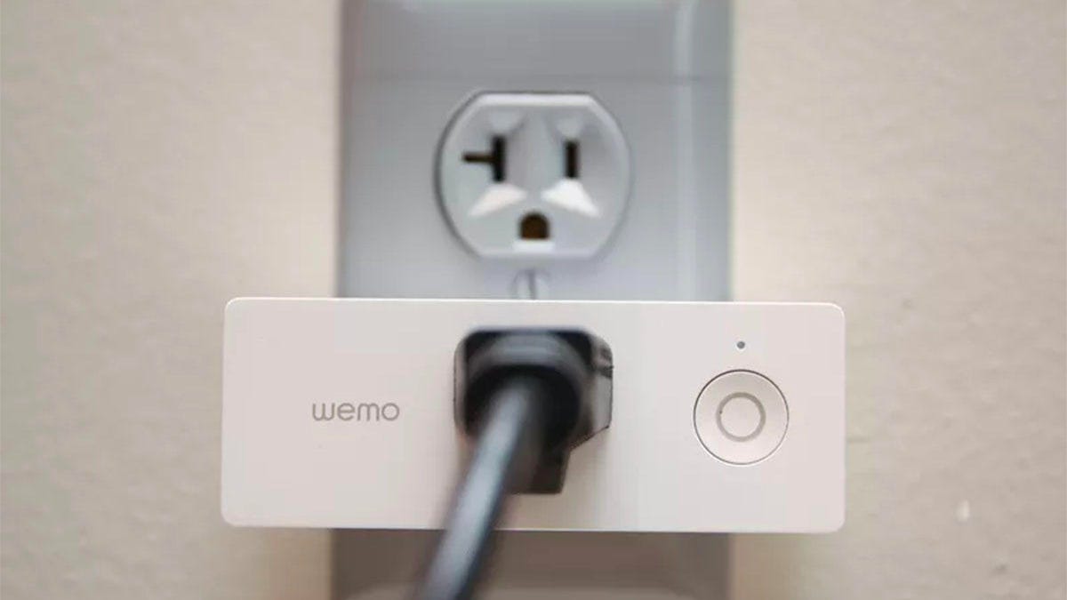 The Belkin WeMo Mini plugged into a wall outlet.