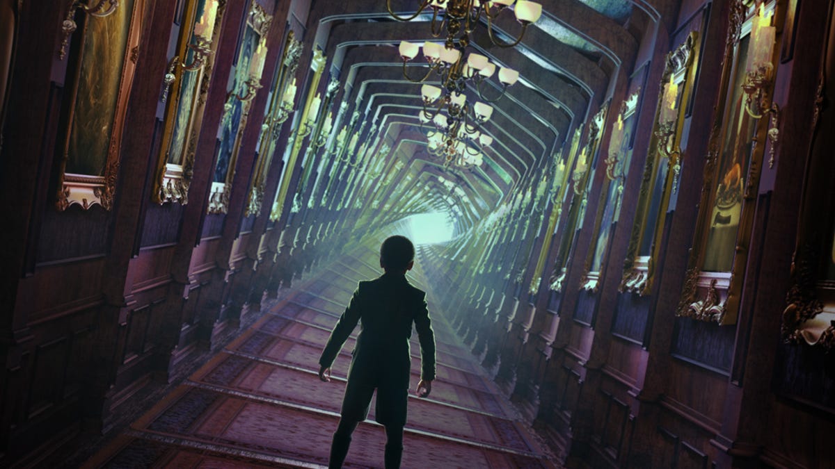 A shadowy figure looks down a twisting hall in Disney's Haunted Mansion