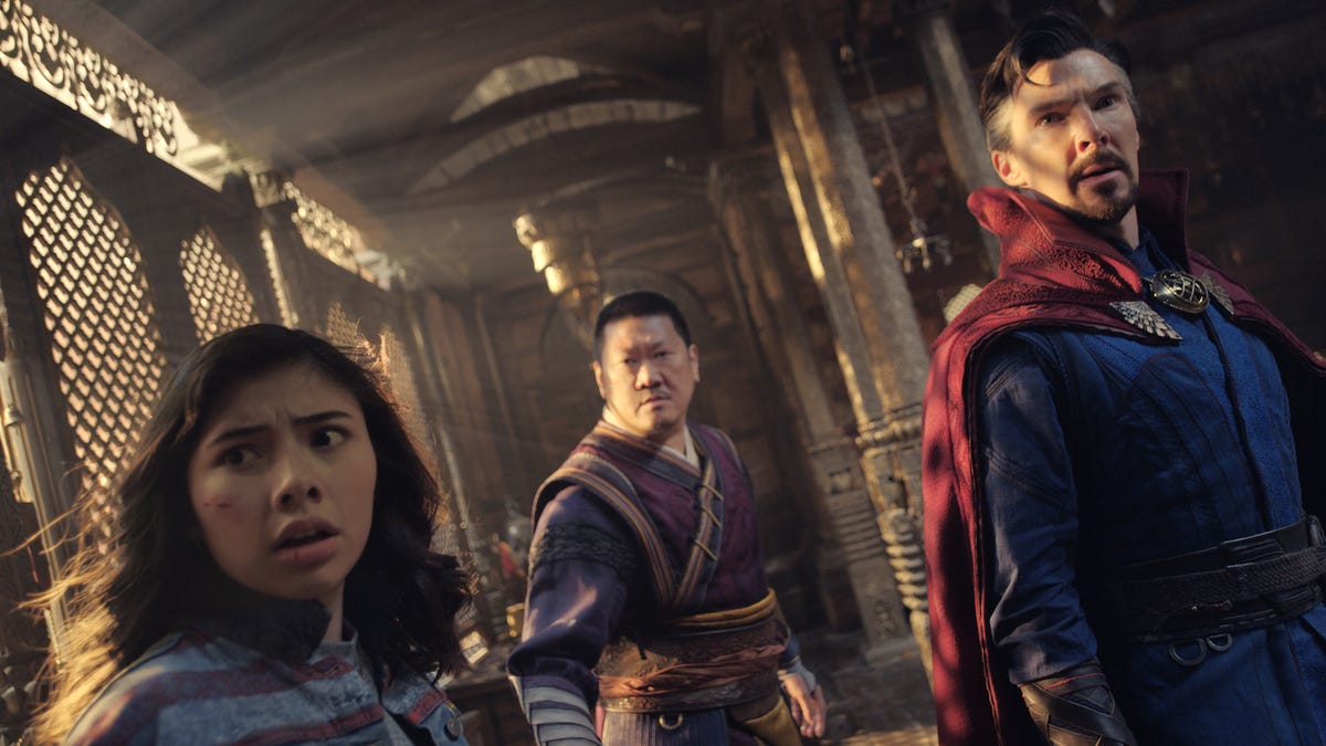 Xochitl Gomez, Benedict Wong and Benedict Cumberbatch look surprised in Marvel's Doctor Strange in the Multiverse of Madness.