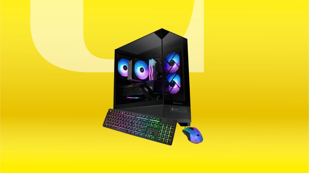 Black gaming PC, keyboard and mouse with pink and blue RGB lights against yellow CNET background.