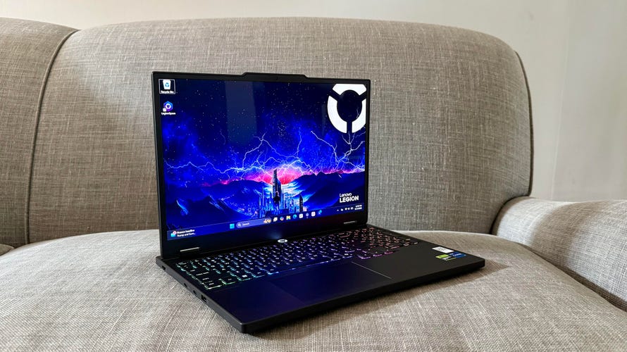 Lenovo Legion 5i Gen 10 gaming laptop on a gray couch