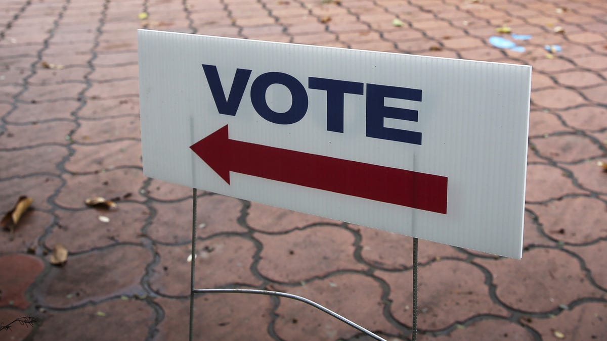 A sign reading "vote" over an arrow