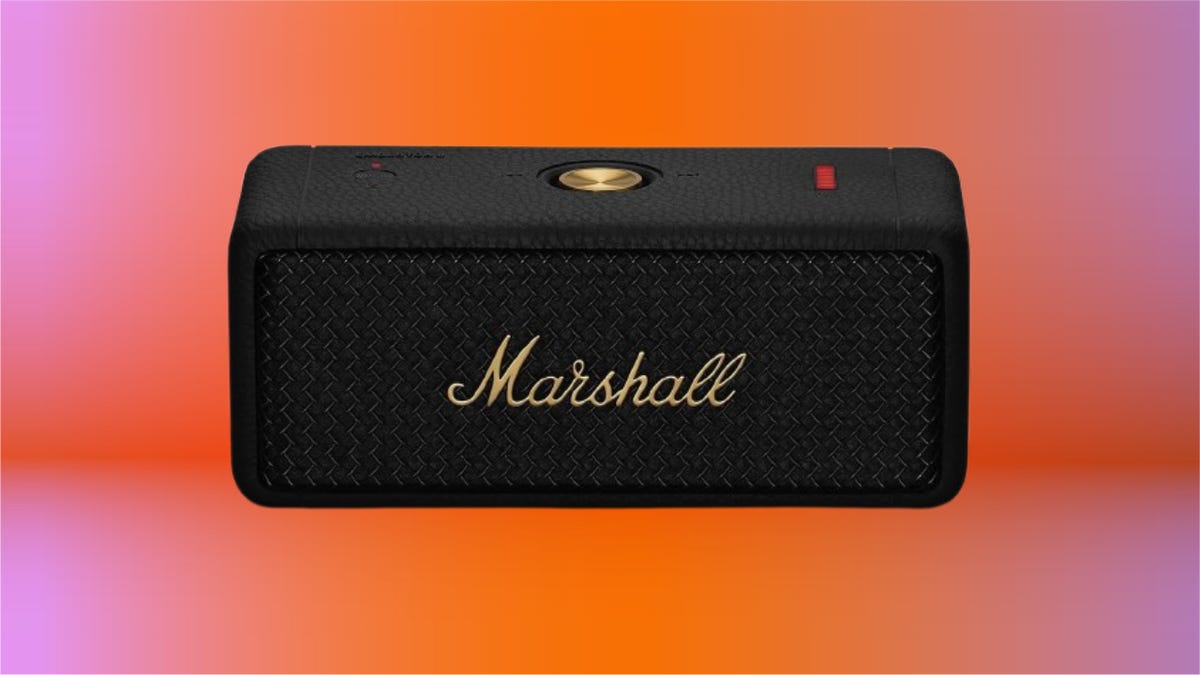 small black speaker with Marshall gold lettering, on an orange background