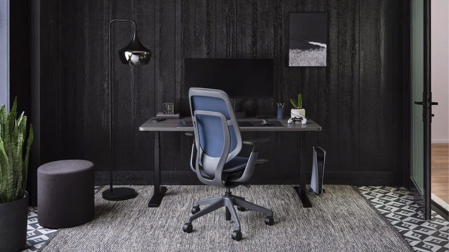 Grey office chair in a green room