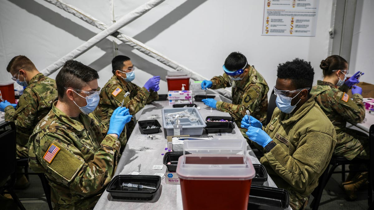 covid-19-masks-booster-shots-vaccines-syringes-bandaids-winter-2021-cnet-057