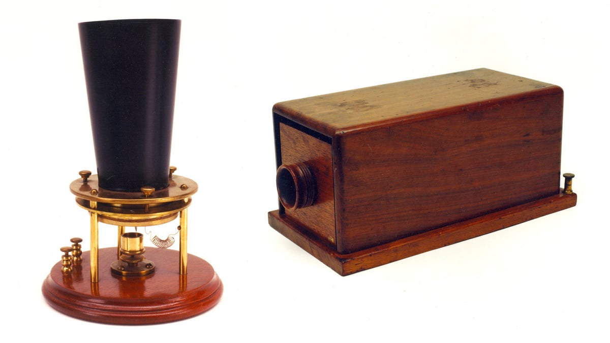 An early conical phone design and a boxy wooden commercial phone.