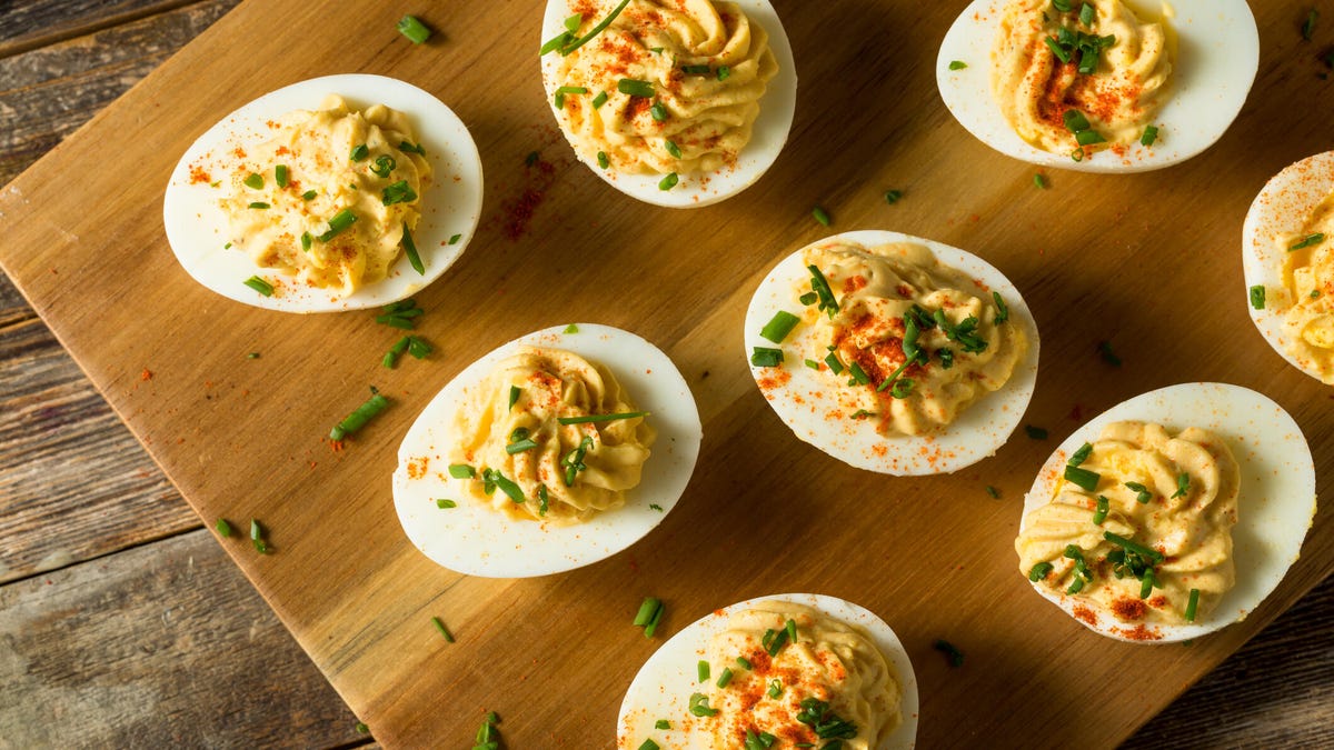 deviled eggs on a wooden cutting board