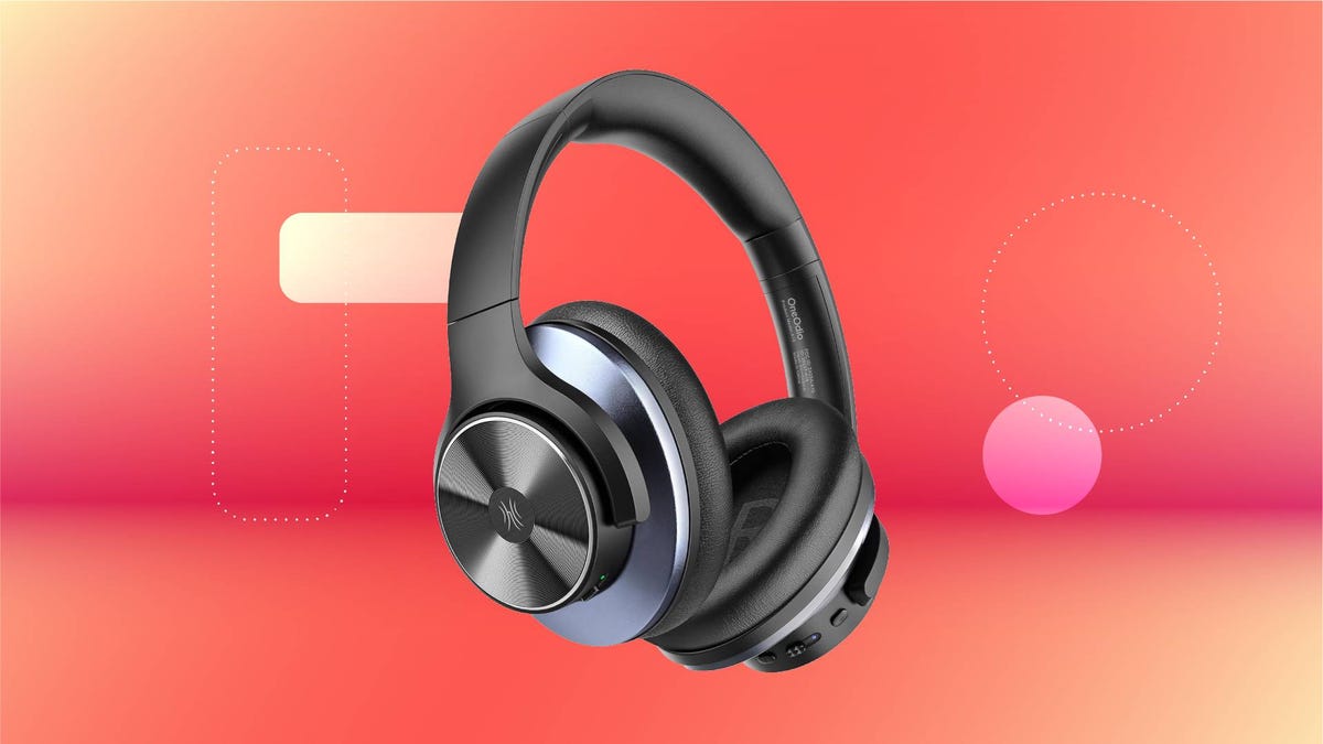 A pair of gray headphones against a red gradient CNET background.