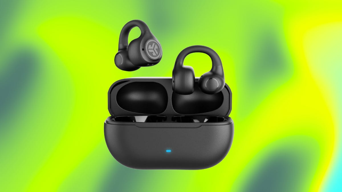 Black JLab clip earbuds in black case against neon green and olive green background.