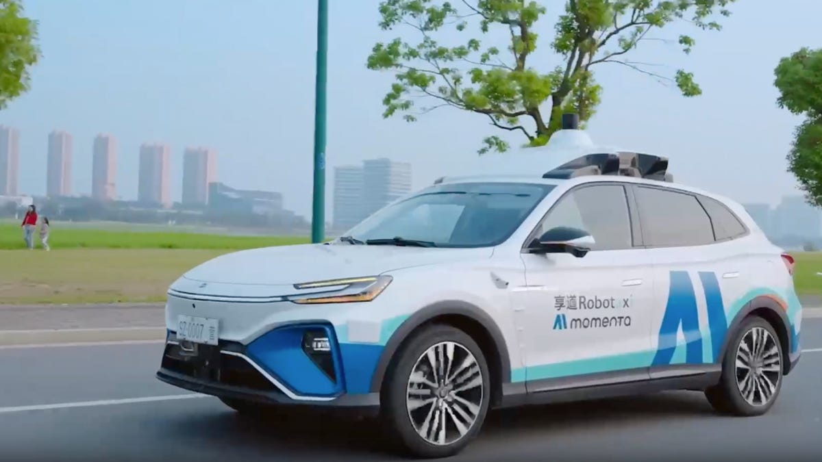 Uber and Momenta logos beside each other.