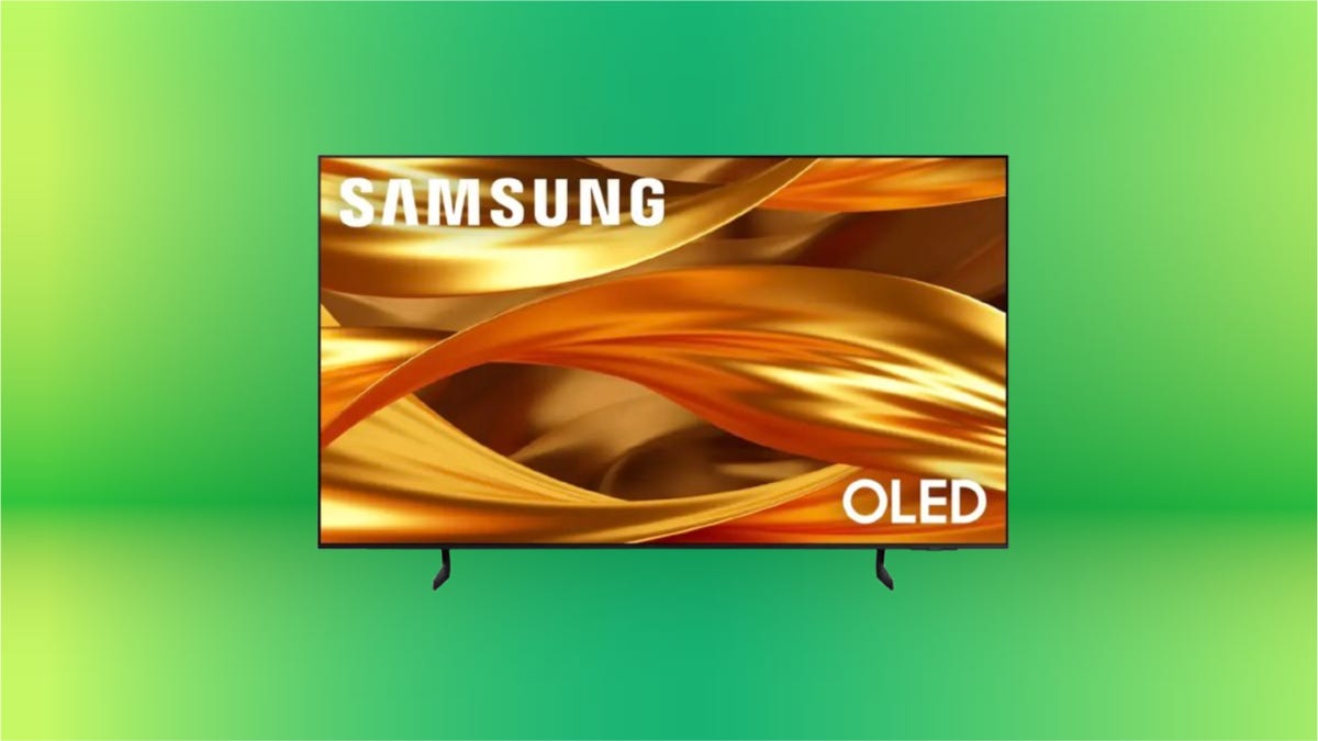 Samsung flatscreen s84f TV against green background.