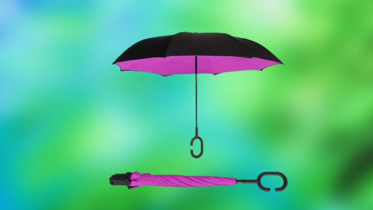 Black and pink umbrella against a gradient green-blue background
